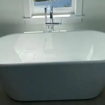 Plumber repairing a residential water heater